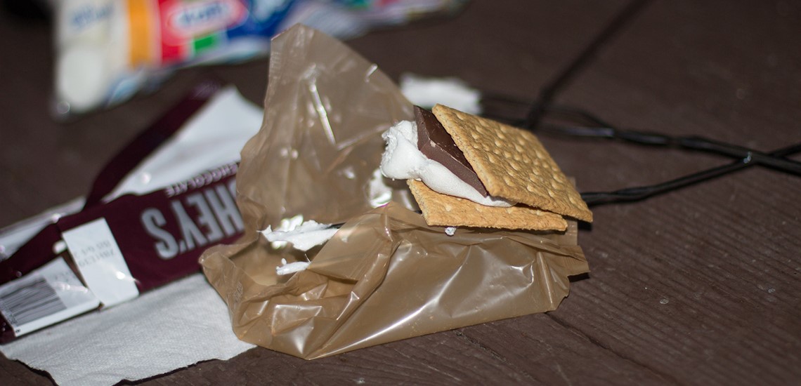 Photo of S'mores on a camping table at night