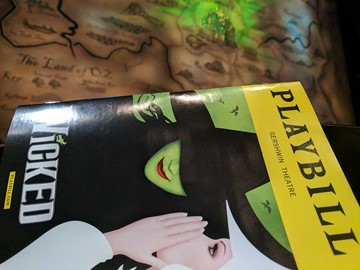 Wicked playbill with Oz map in the background